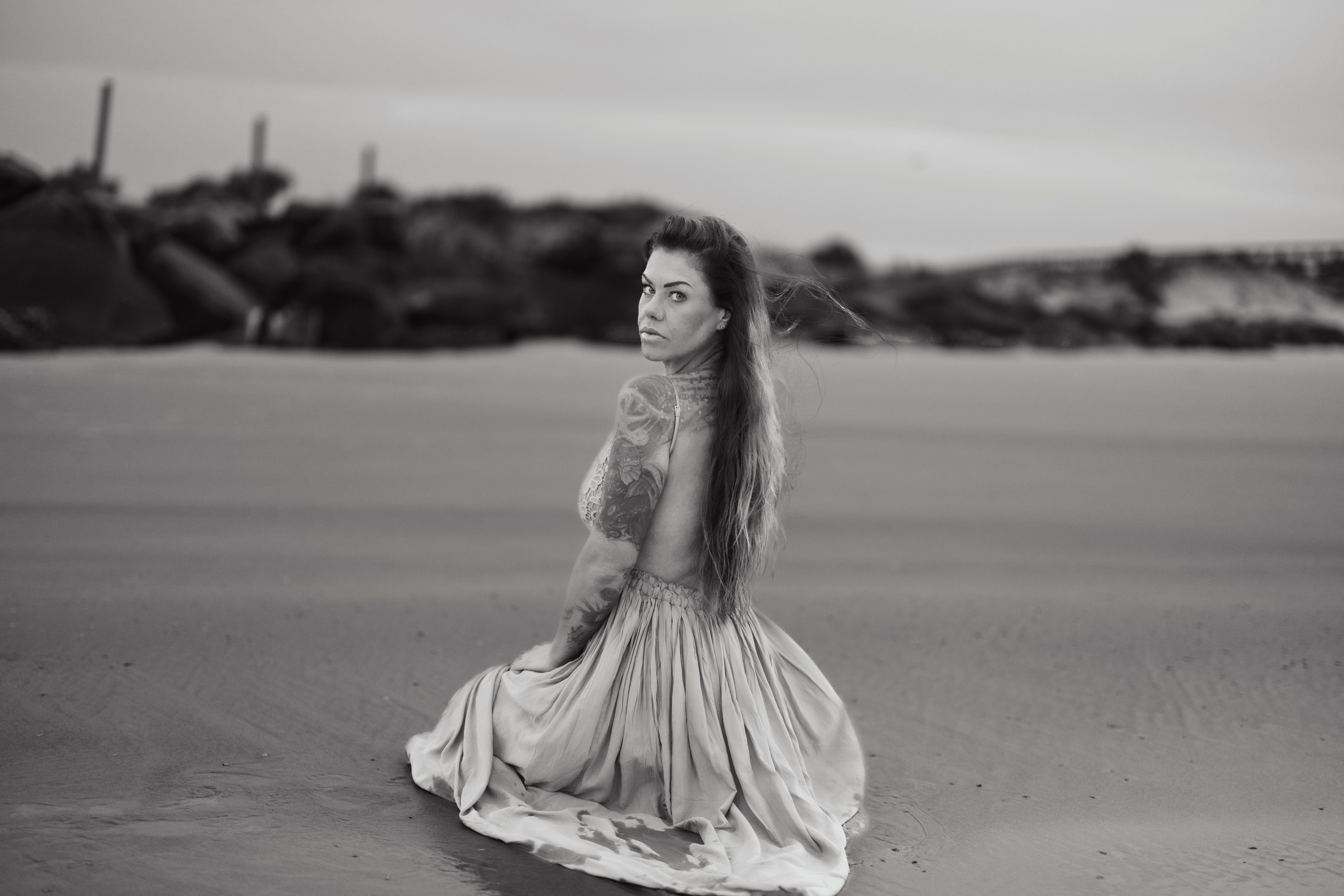 Woman Wearing Dress and Posing on a Beach in Black and White · Free ...