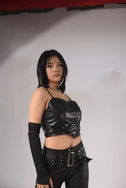 Free Portrait of a woman in black leather fashion, exuding confidence and style. Stock Photo