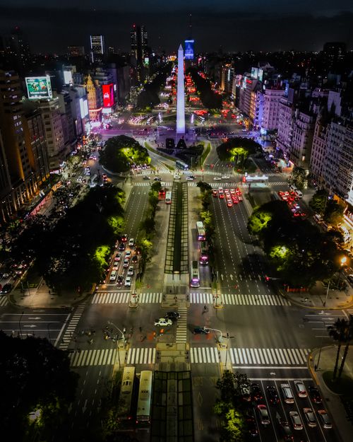 Free Stunning aerial view of Buenos Aires cityscape featuring the illuminated Obelisk at night. Stock Photo