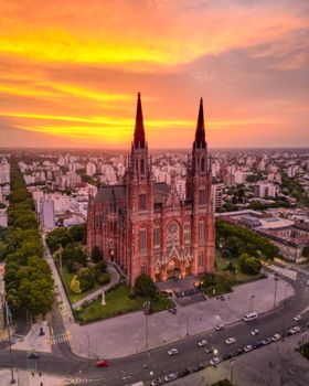 Aerial view of La Plata Cathedral during a vibrant sunset in Buenos Aires, Argentina.