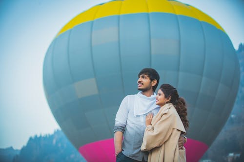 Couple Standing Near Hot Air Balloon