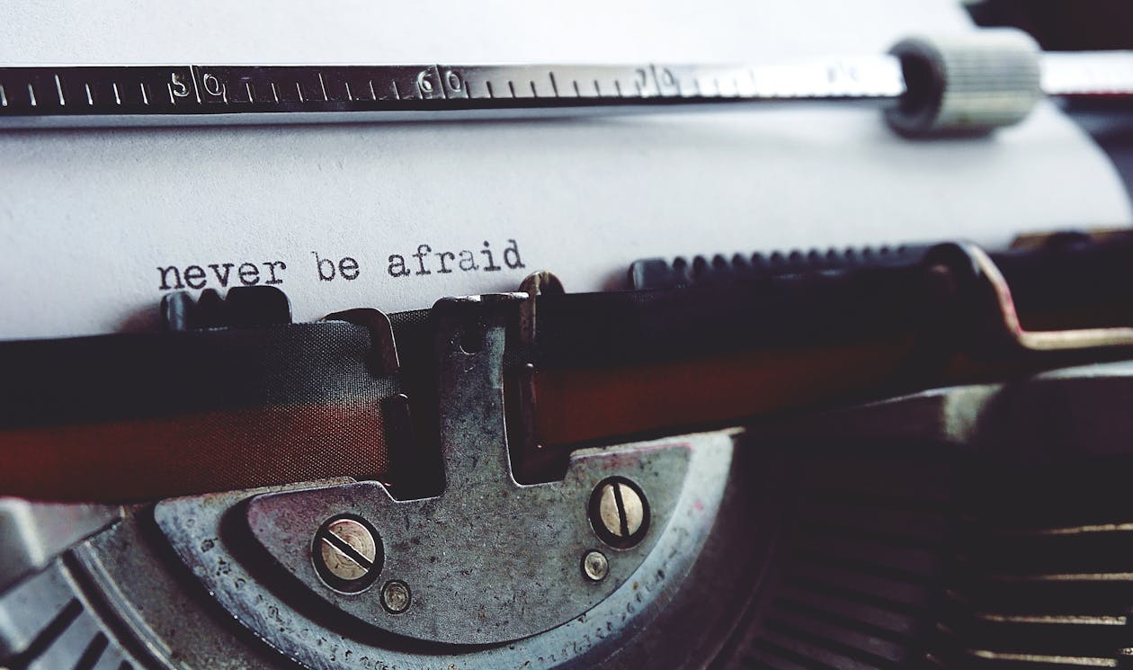 Free Never Be Afraid on Typewriter Stock Photo