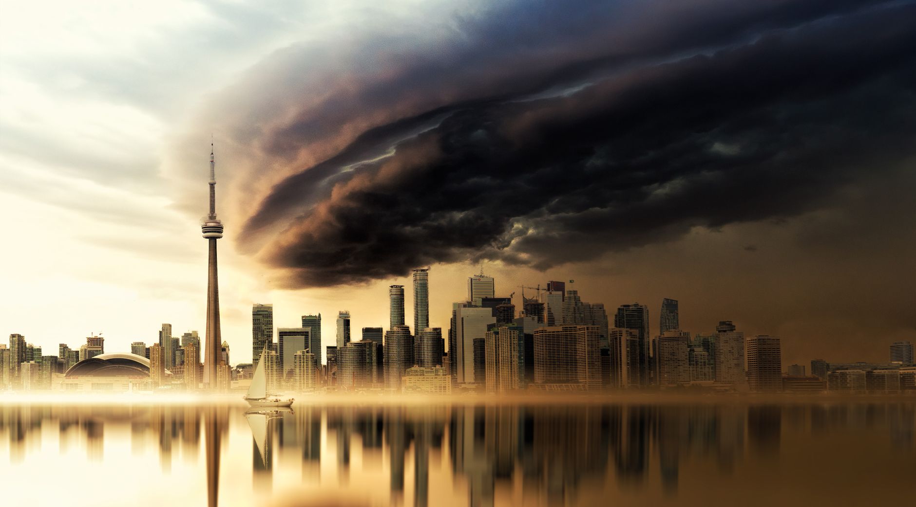 Breathtaking view of Toronto skyline with CN Tower at sunset, reflecting over water.