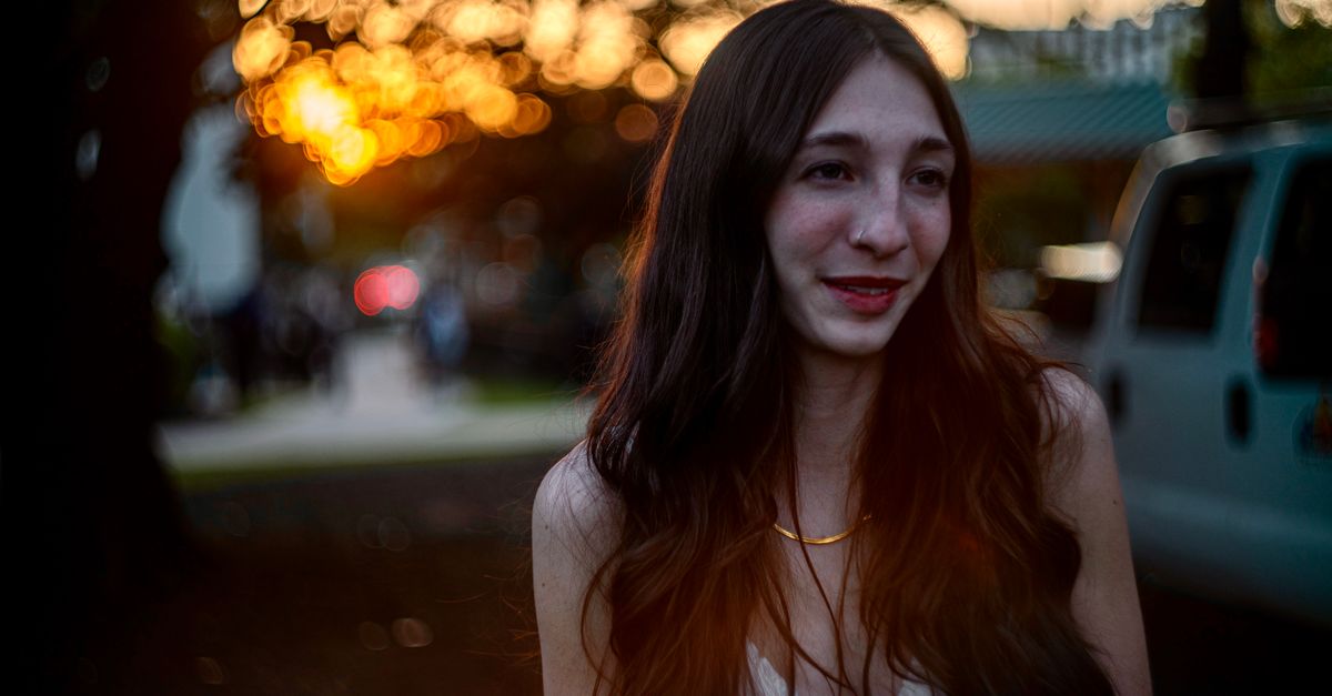 Captivating portrait of a woman at sunset in Decatur, GA. Vibrant and warm ambiance with a natural smile.