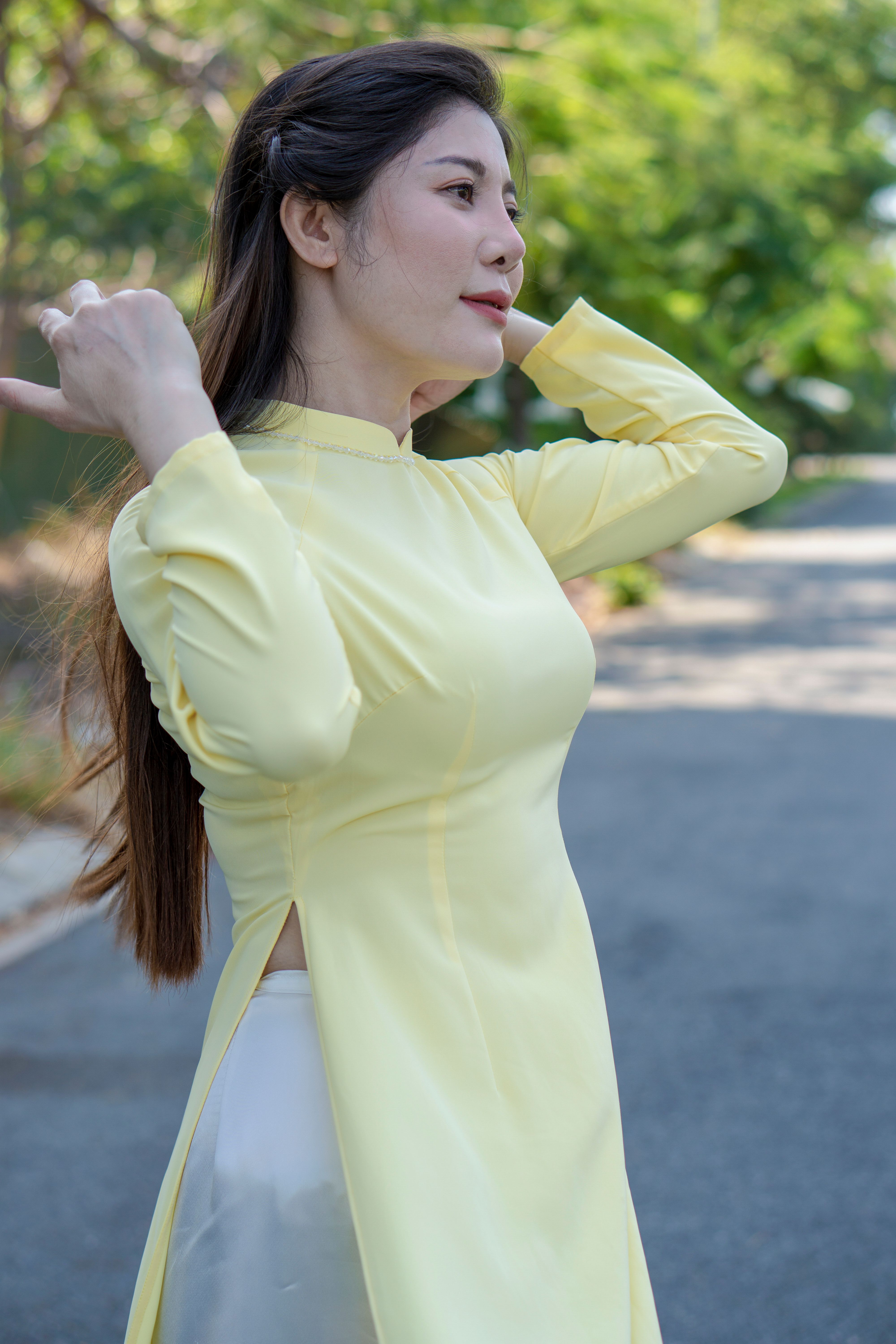 Beautiful Woman in Yellow Dress Standing on Street · Free Stock Photo
