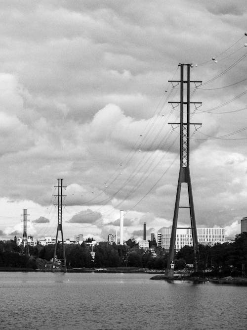 A black and white photo of a city with power lines