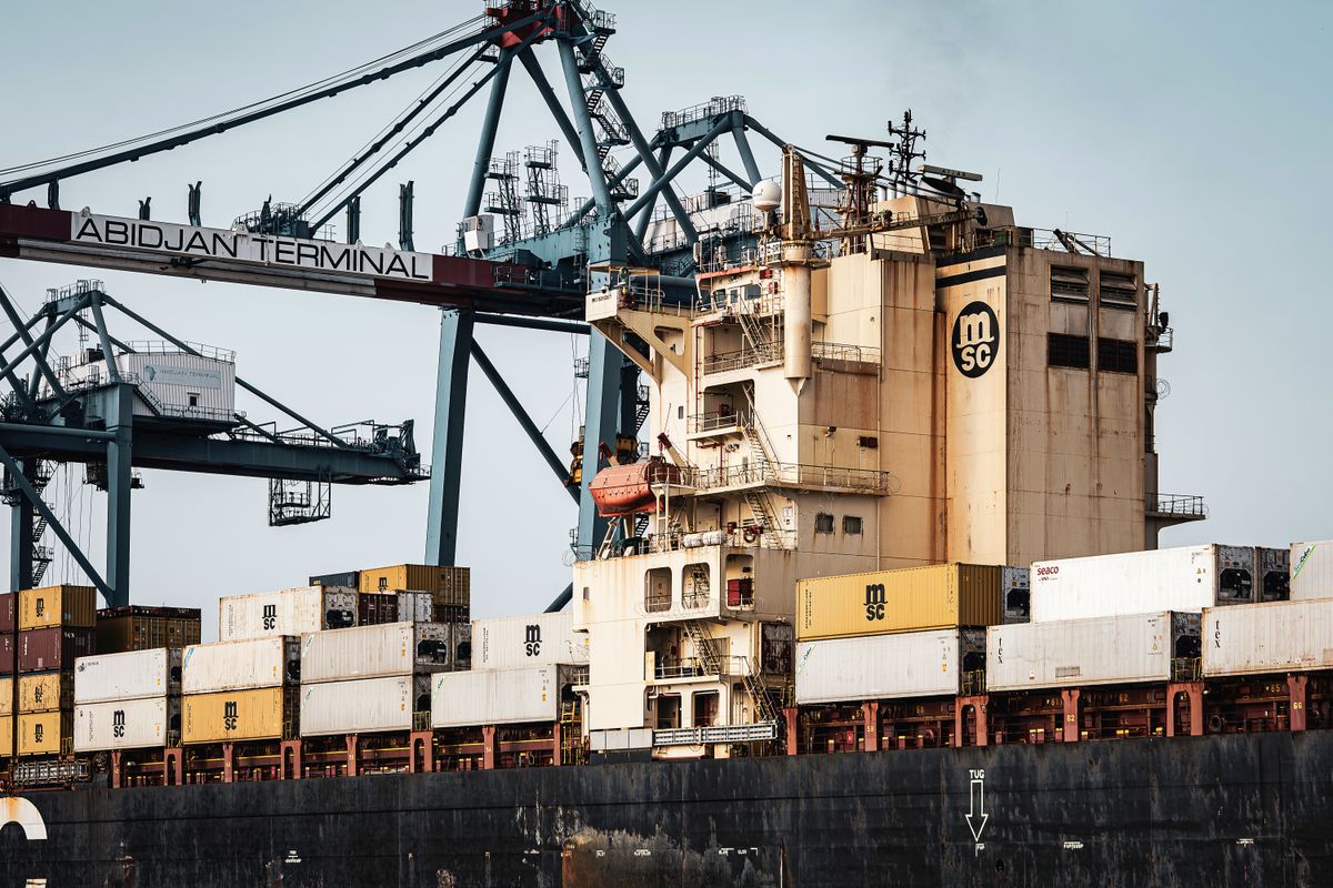 Shipping containers and cranes at Abidjan Terminal