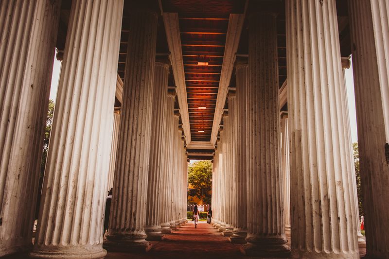 Dramatic view of ancient pillars at a famous landmark in Kolkata, India.