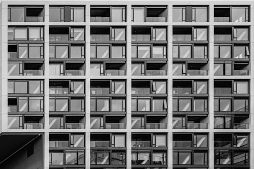 Black and white photograph of a building with many windows