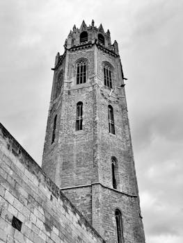 A striking view of the Gothic bell tower at La Seu Vella in Lleida, showcasing its intricate Romanesque architecture.
