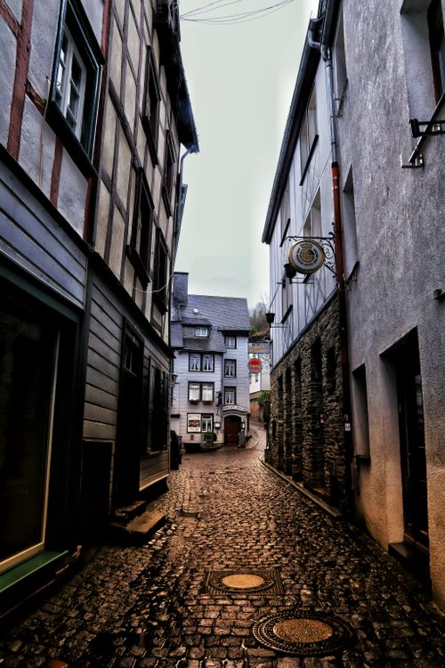 Free Discover the quaint cobblestone streets of Monschau, Germany on a rainy day. Rich in history and charm. Stock Photo