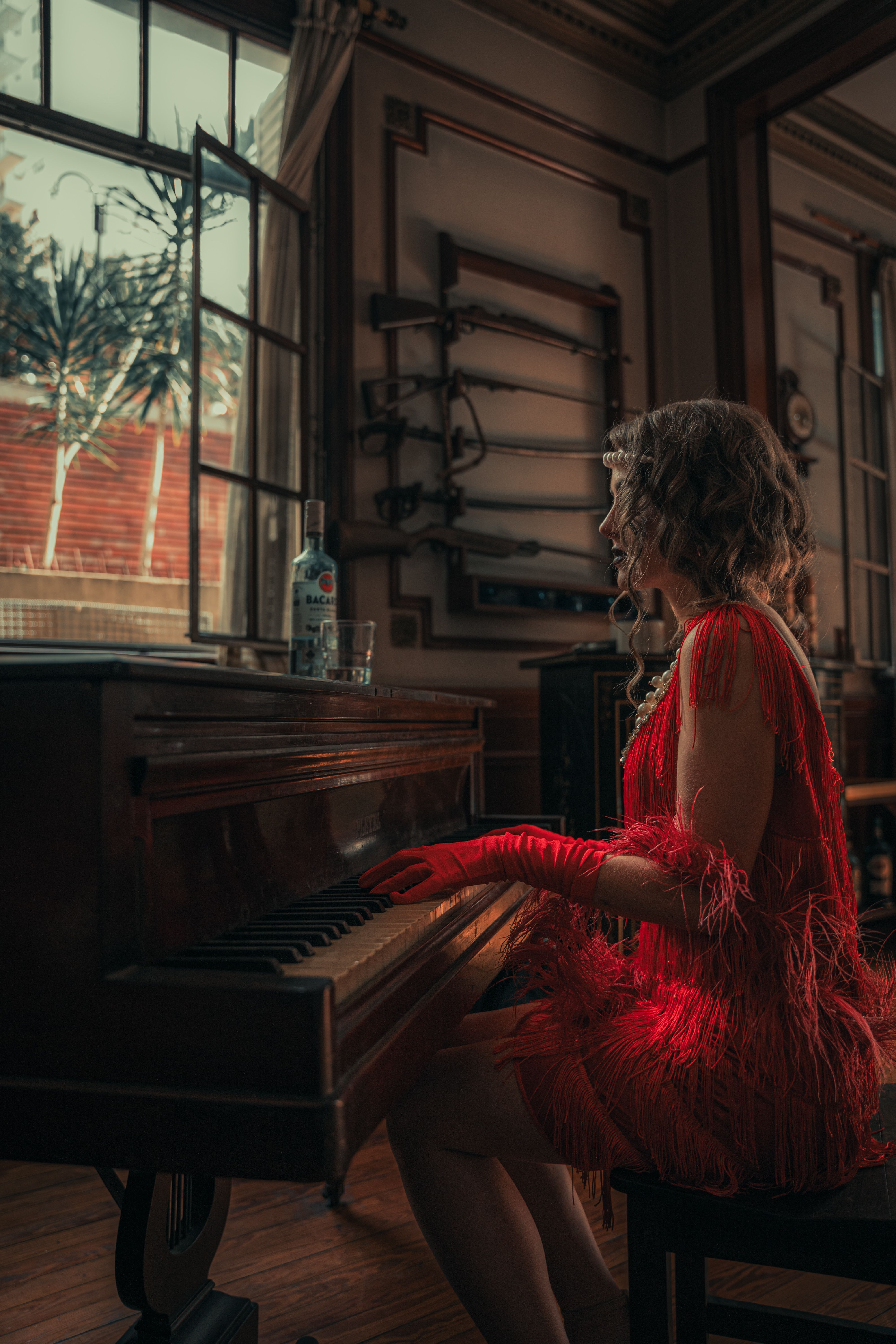 Elegant Woman in Red Dress Playing on Piano · Free Stock Photo