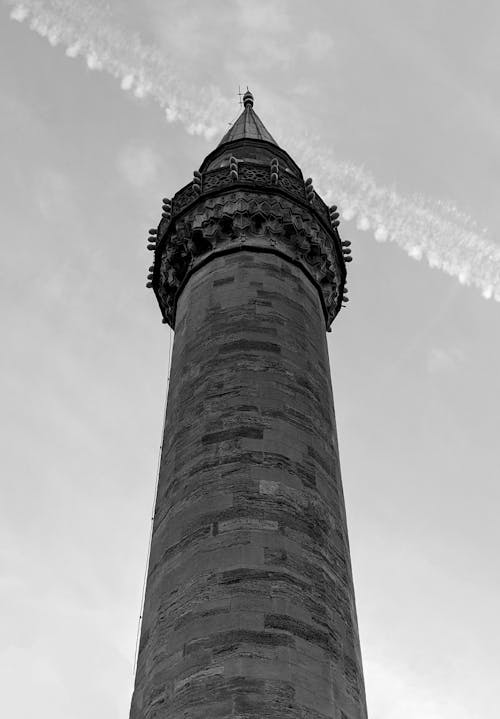 A black and white photo of a tall tower