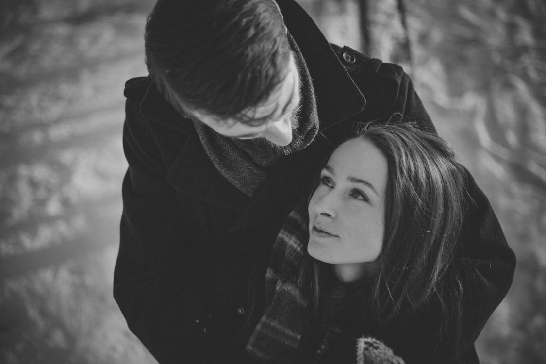 Man Hugging Smiling Woman from Behind · Free Stock Photo