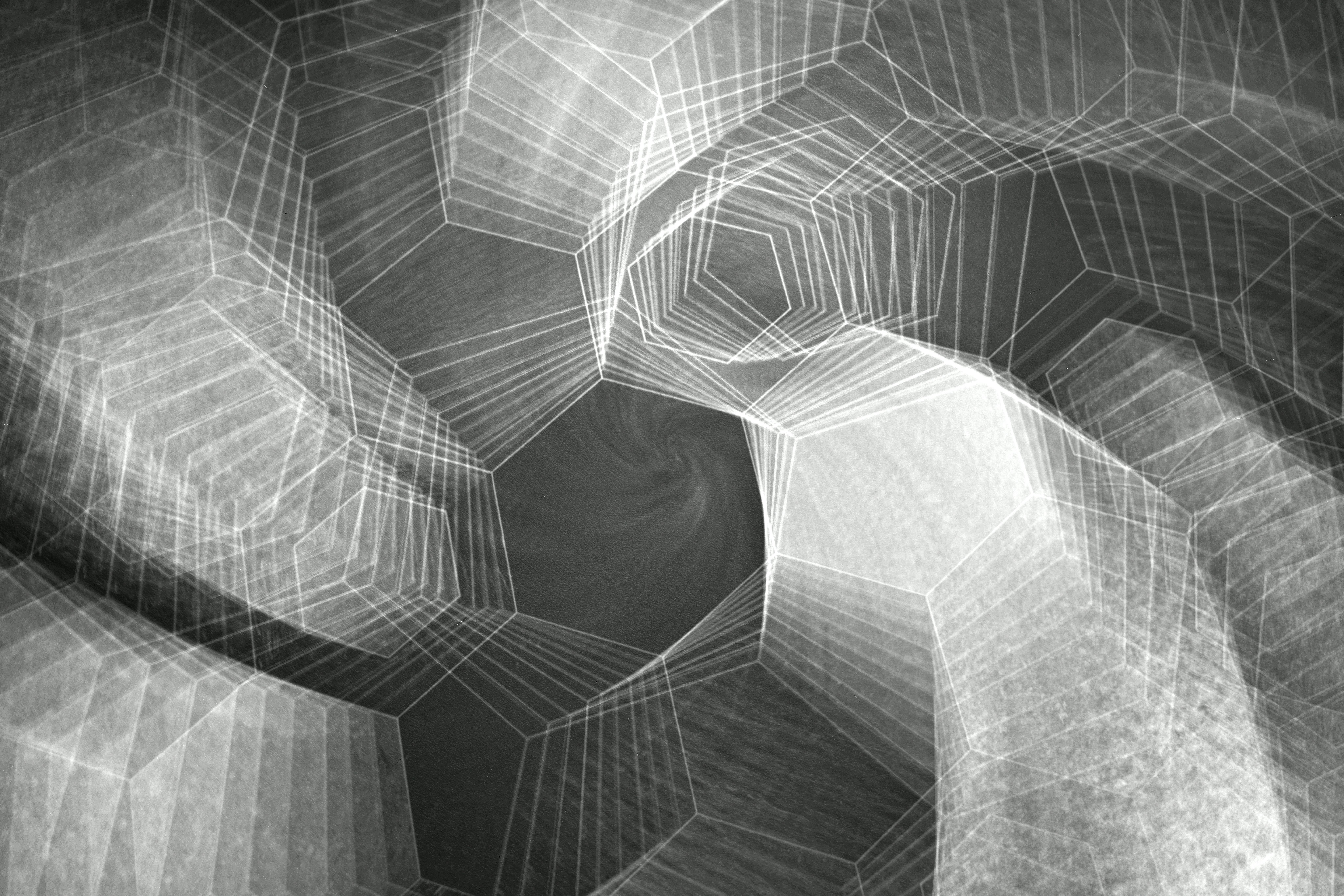 Black and white abstract pattern with geometric shapes and swirling design.