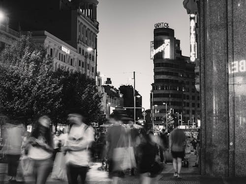 Black and white photo of people walking on the street