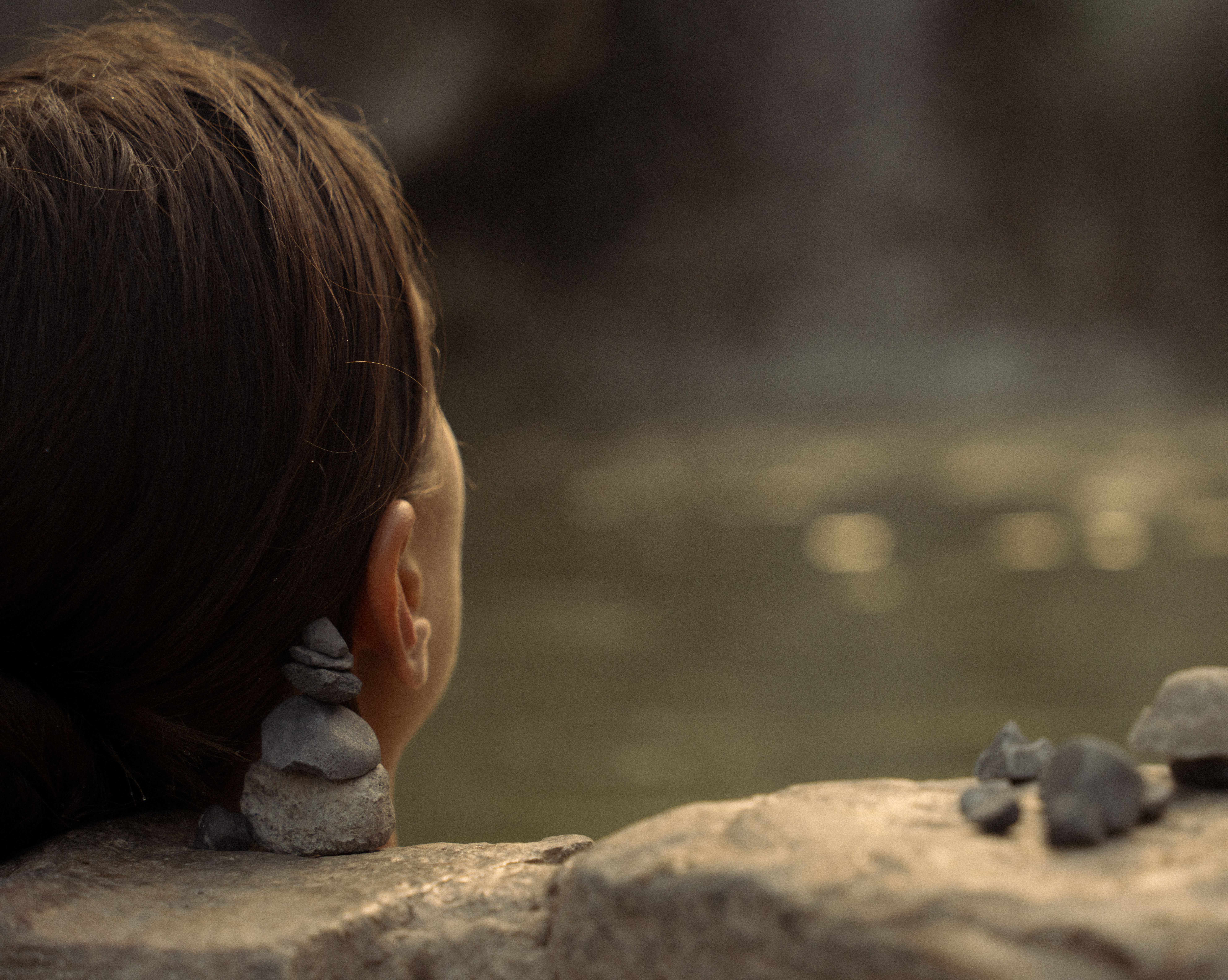 Back View of a Woman Sitting in the Water · Free Stock Photo