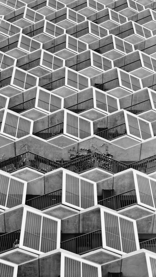 A black and white photo of a building with many cubes