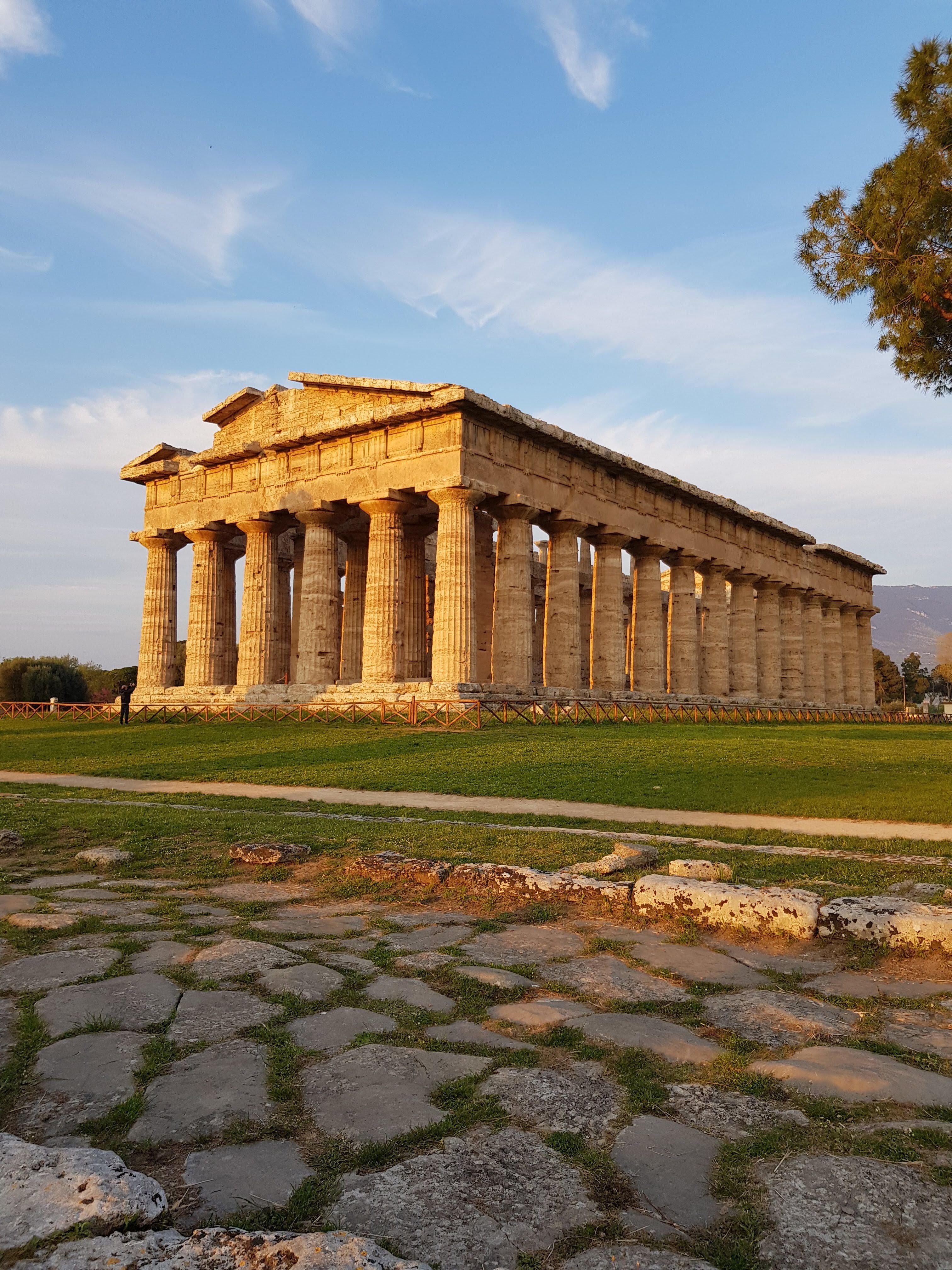 Capture of the ancient Temple of Hera II at Paestum, Italy, during sunset. Explore its majestic ruins.