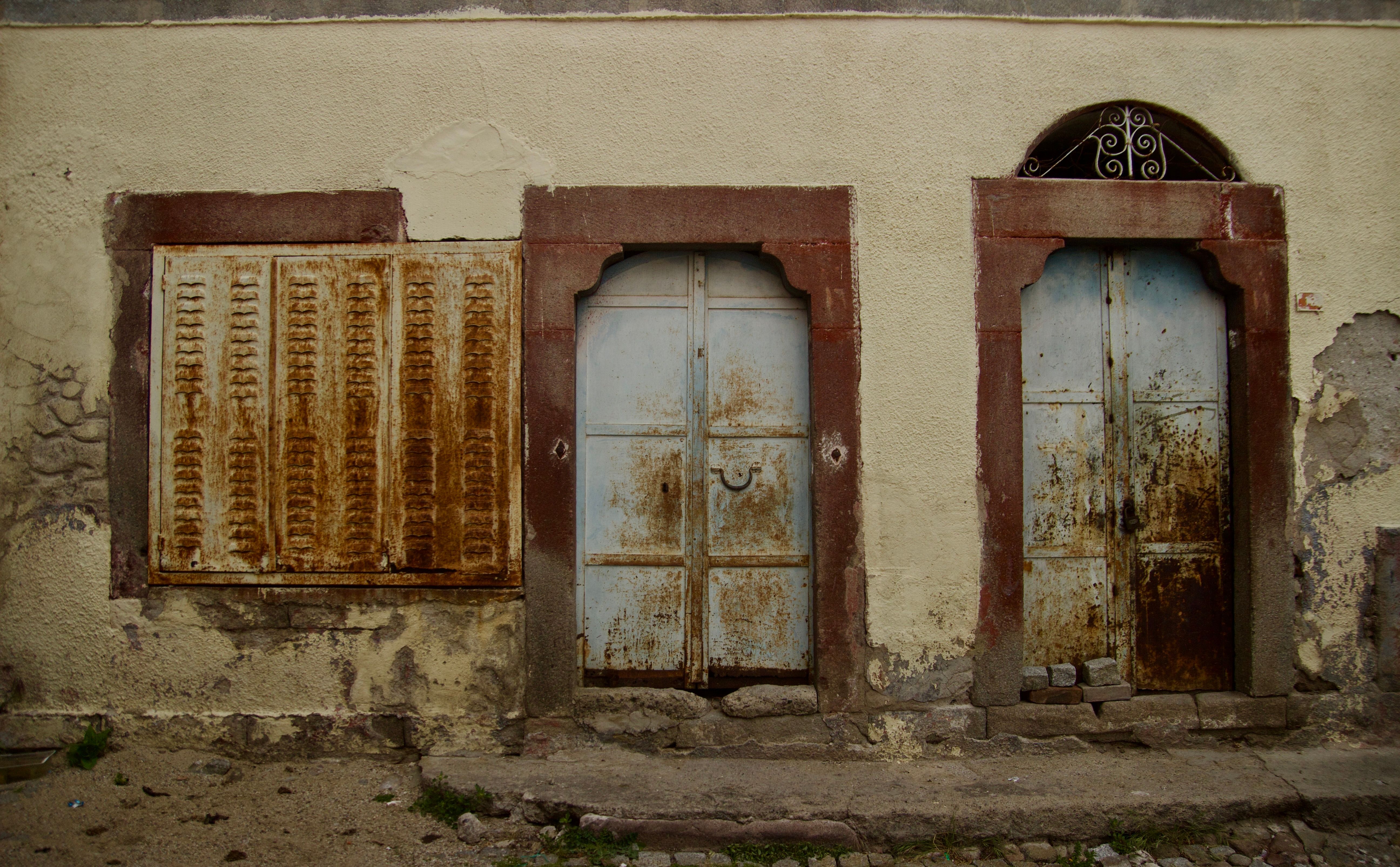 Neglected Rusty Metal Doors and Shutters · Free Stock Photo