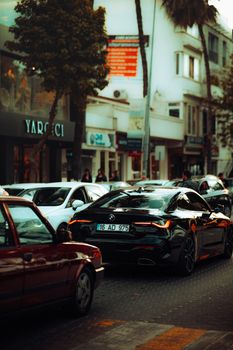 A bustling city street with modern vehicles highlighting urban life and traffic dynamics.