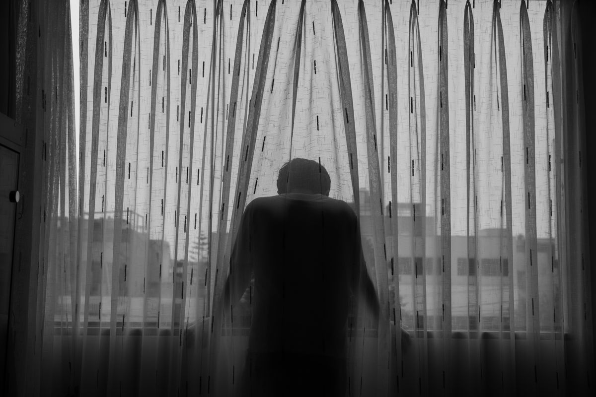 Silhouette Photo of Person Standing in Front of Window · Free Stock Photo