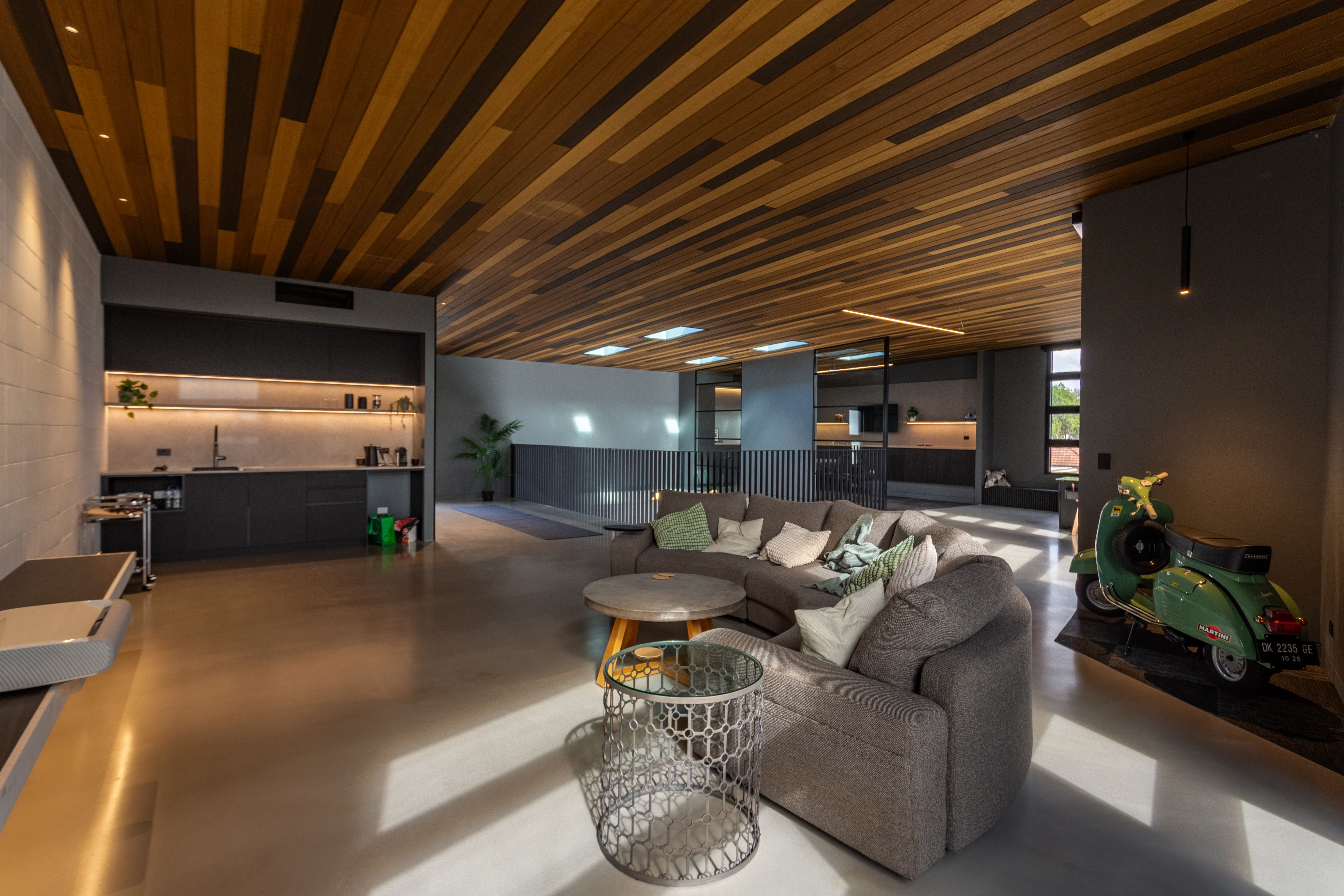Spacious modern living area with stylish decor and an upscale feel.