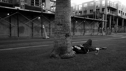 Man relaxing outside contruction site
