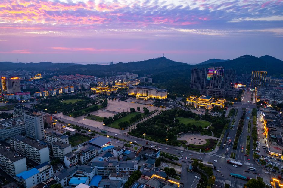 Jiujiang in May - Vibrant city street with local shops and cafes