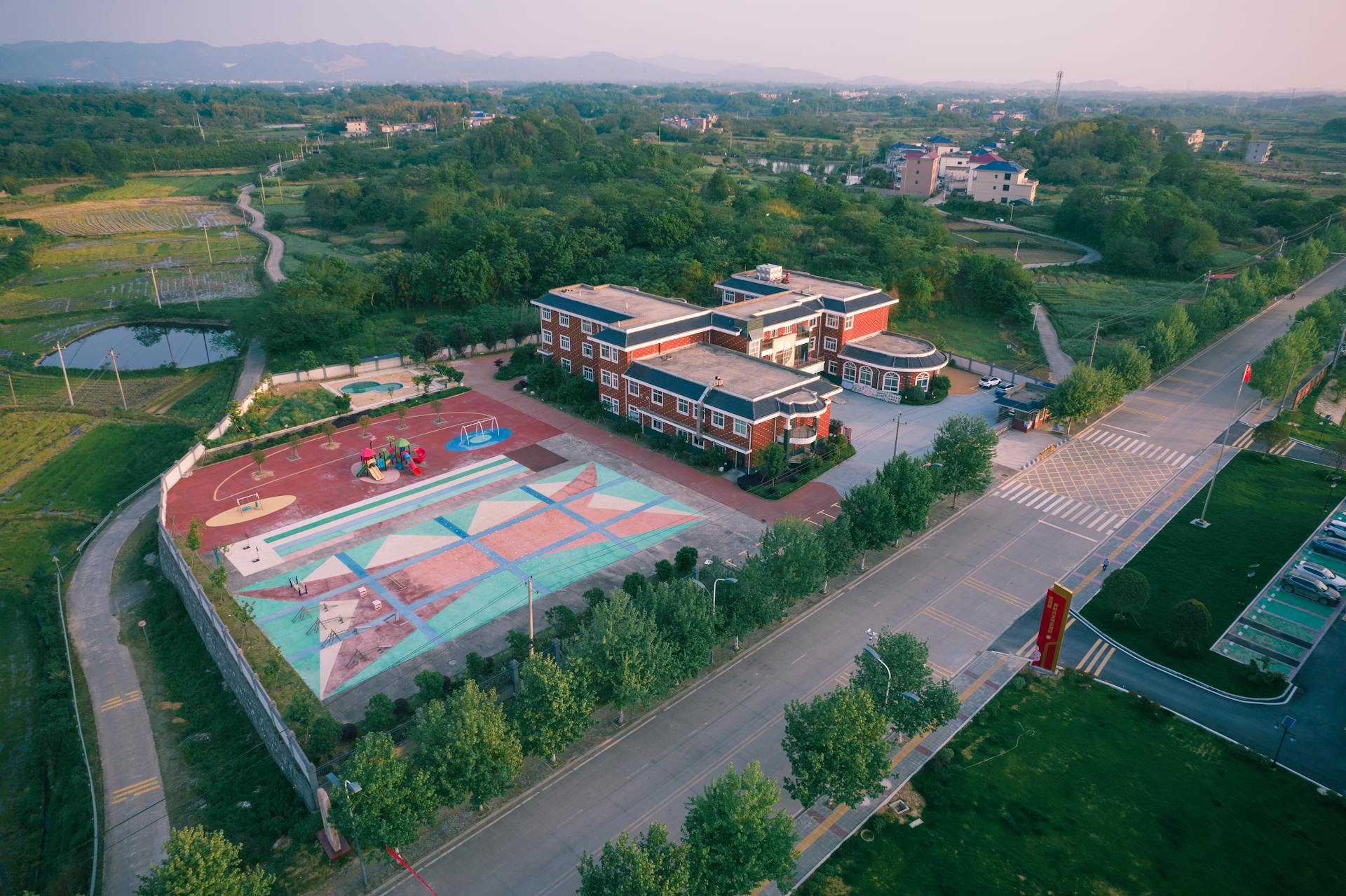 Drone Shot of School Building with Playground