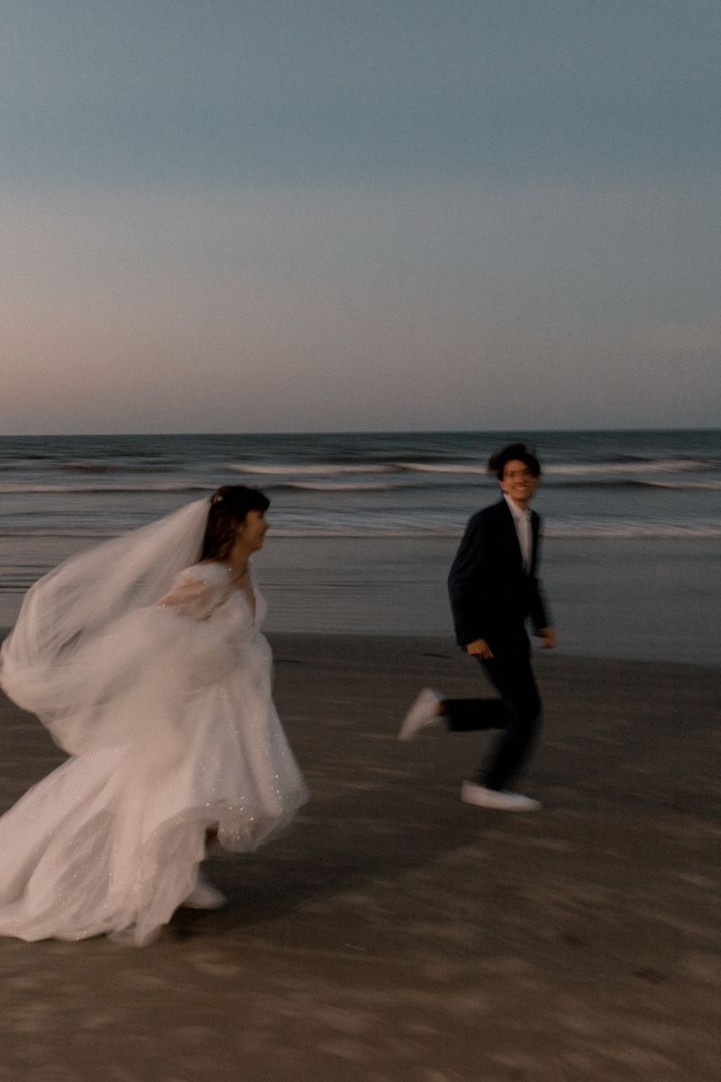 Couple running together on a beach
