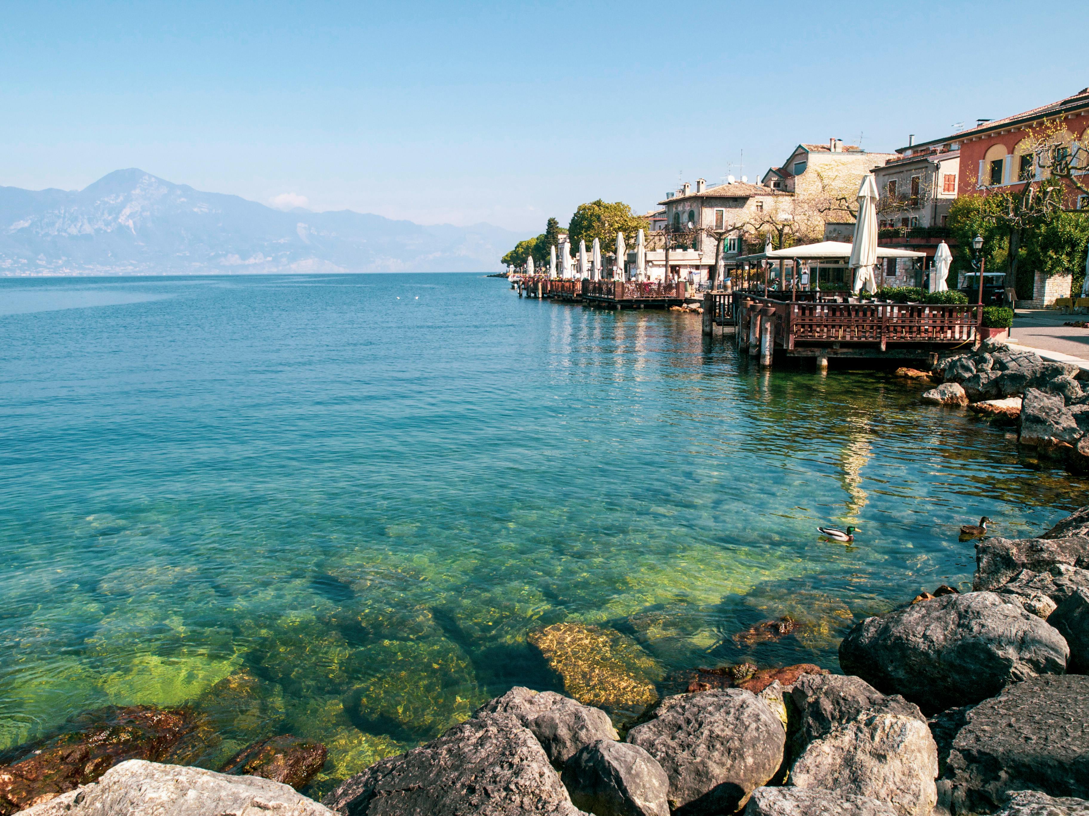 clear sea water in beach with cottages