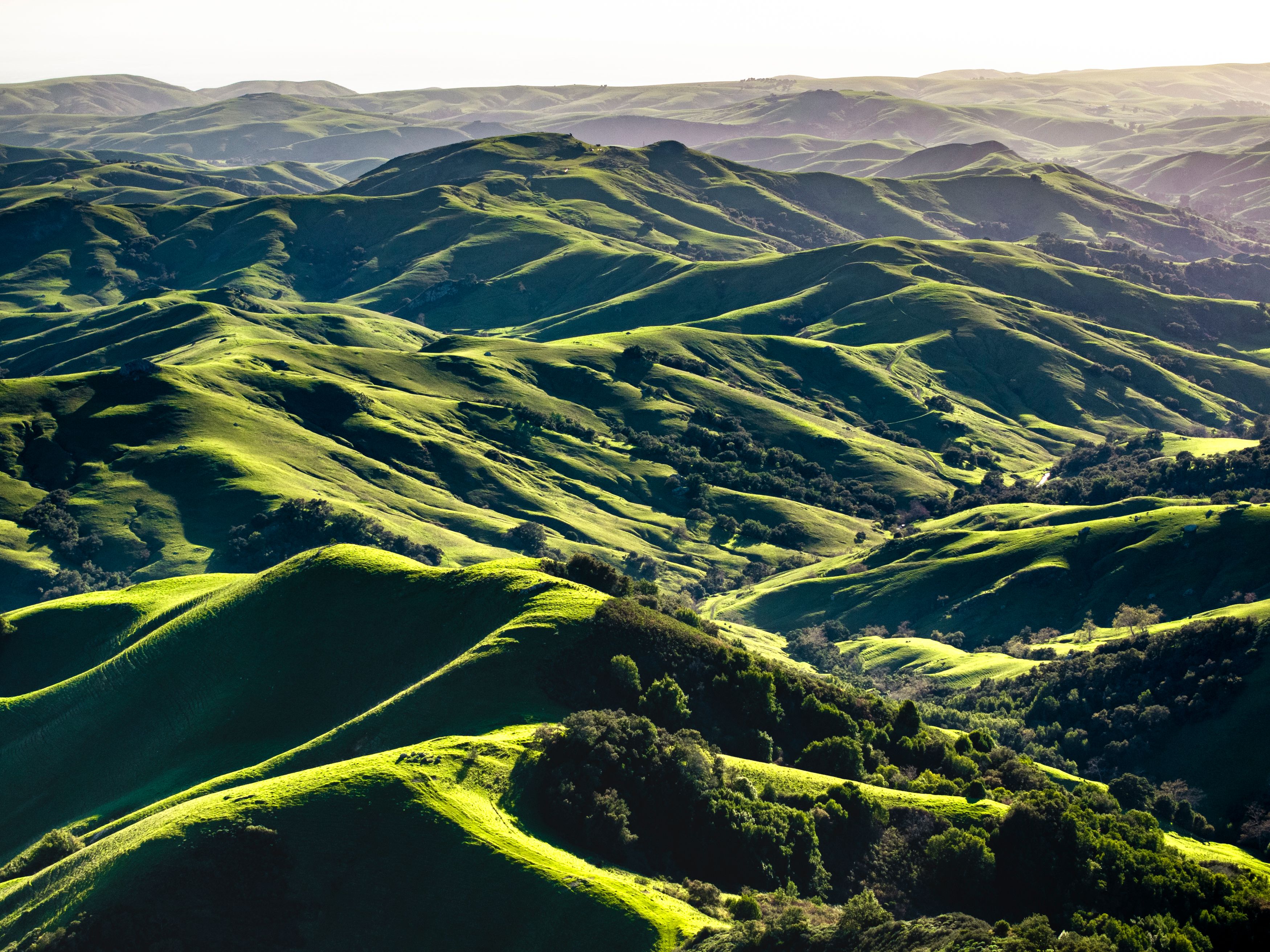A scenic view of green hills and valleys · Free Stock Photo