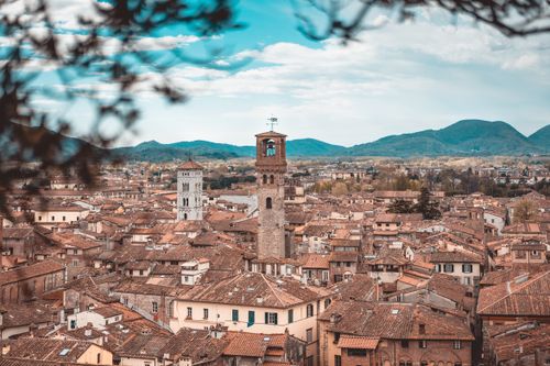 Free Charming aerial view of Lucca's historic buildings and clock towers in Tuscany. Stock Photo
