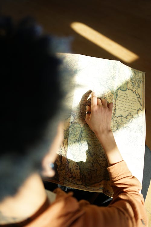 A person is holding a map and looking at it