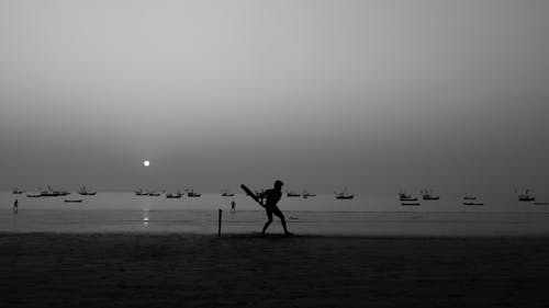 Playing cricket at seashore on Dahanu beach