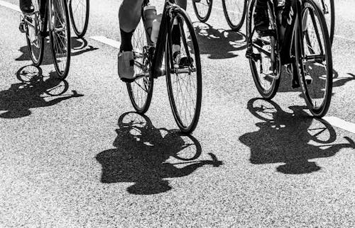 A black and white photo of a group of cyclists
