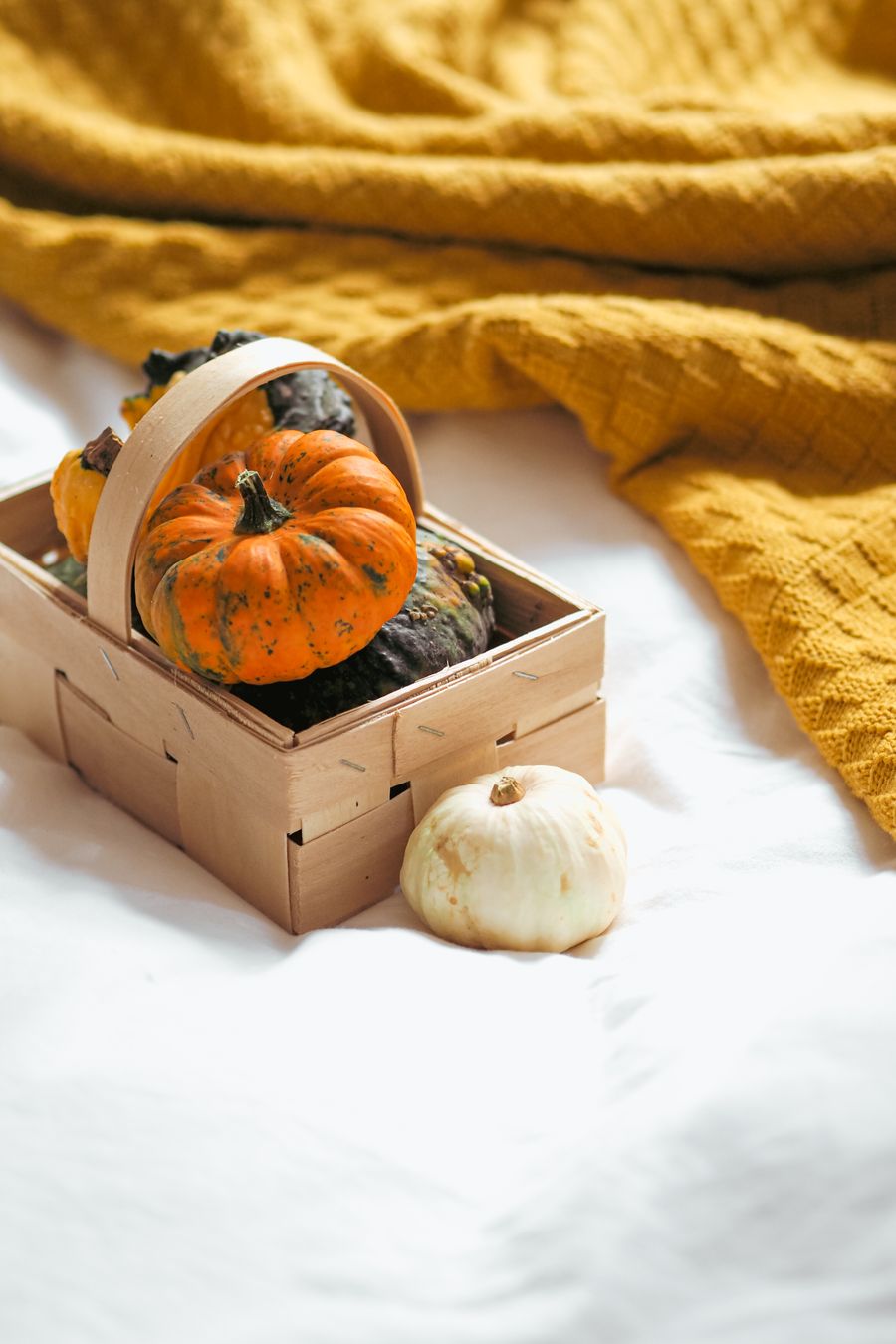 Basket filled with pumpkins for natural autumn home decorating