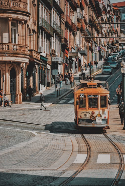 Free Selective Focus Photography of Orange Tram Stock Photo