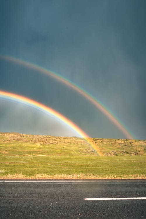 Rainbow Across the Road during Daytije
