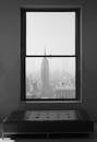 Empire State Building behind Window in New York in the USA