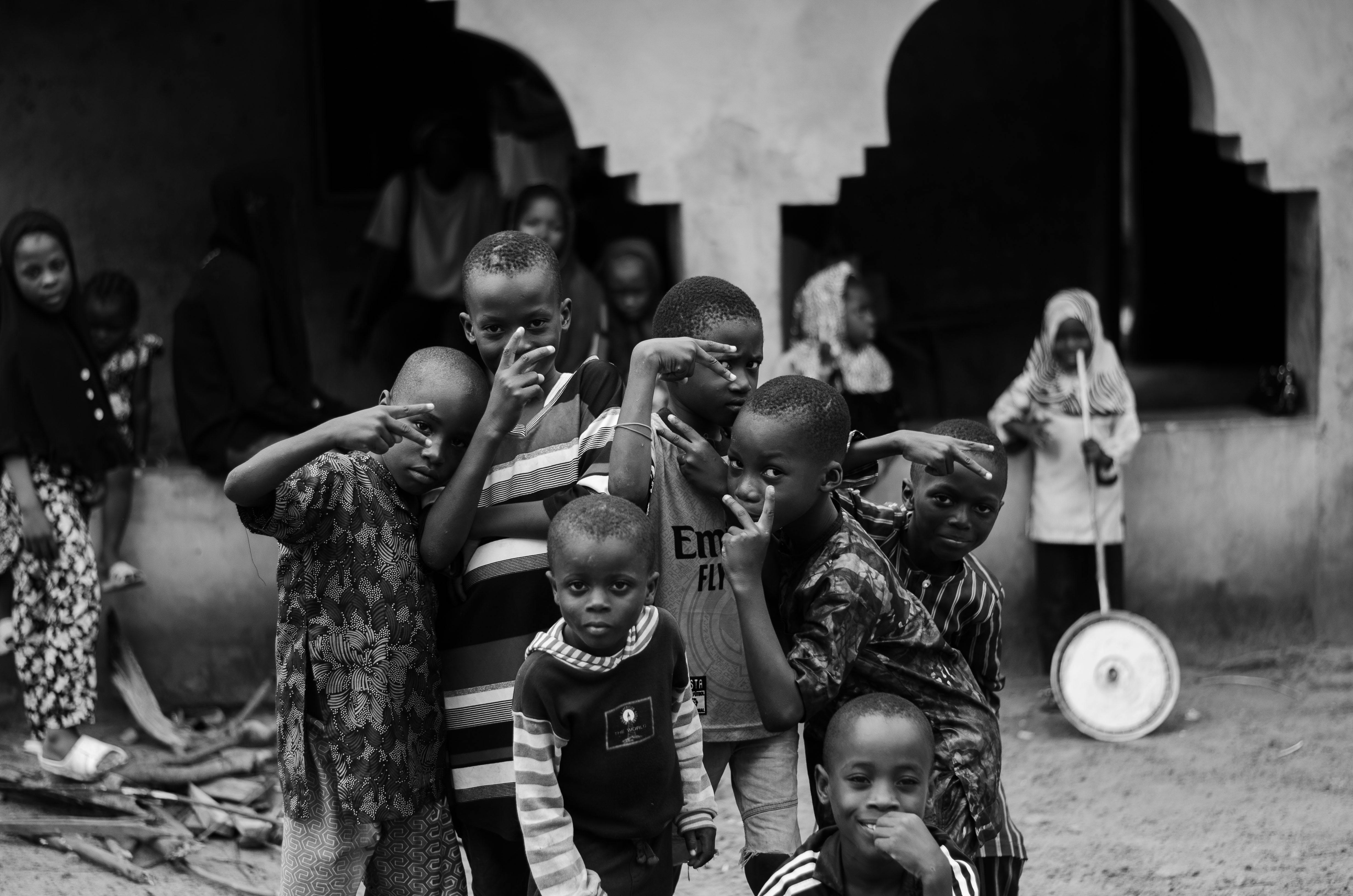 group of children posing in black and white