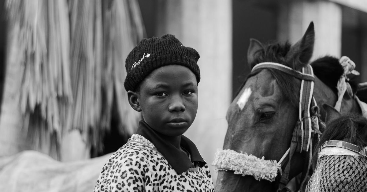 Boy Riding A Leopard Portrait of a Boy Wearing a Leopard Print · Free Stock Photo