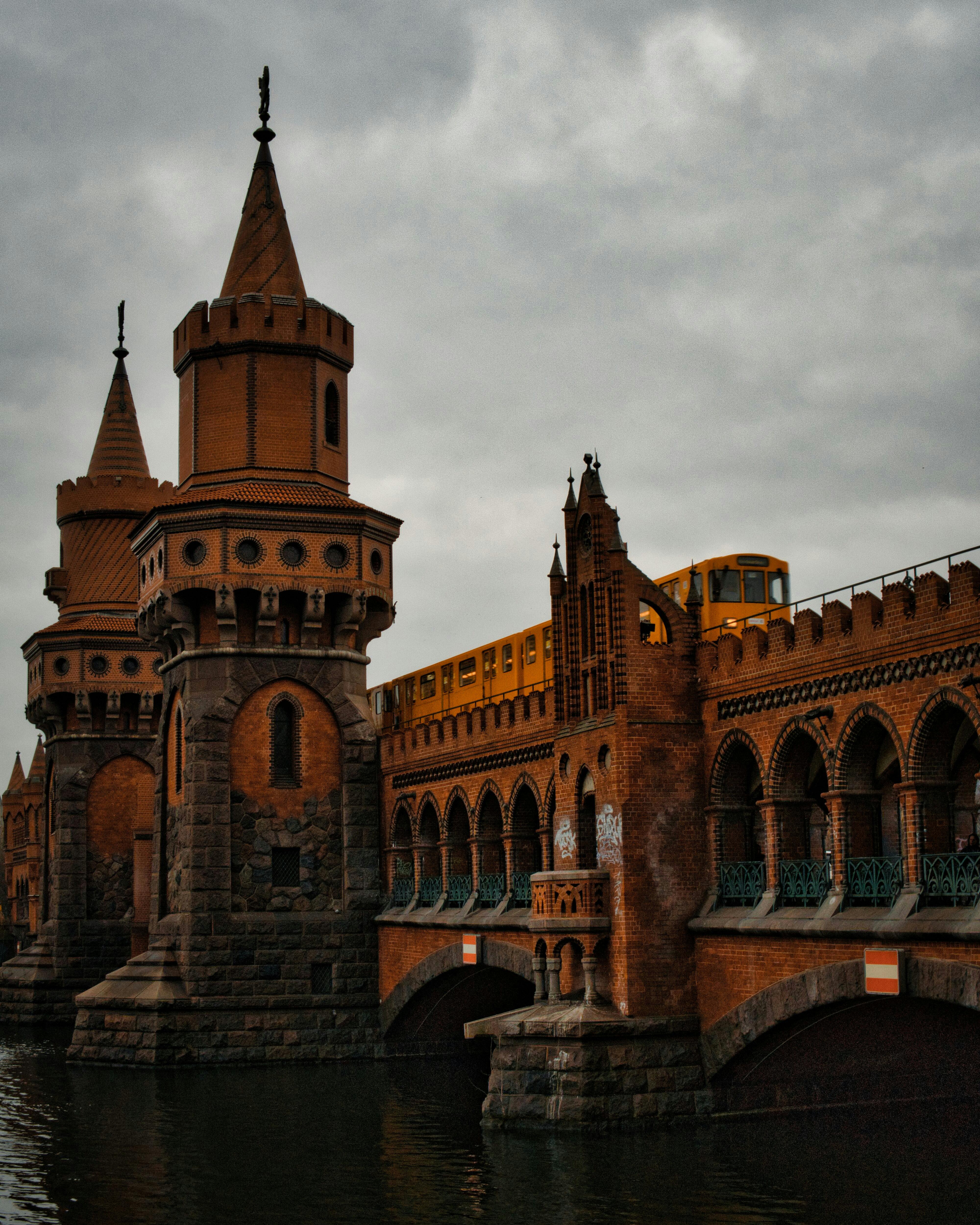 waterfront view of oberbaum bridge across river spree in berlin germany