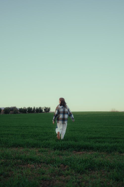 A person walking through a field
