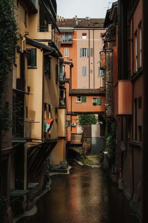 View of a Canal between Apartment Buildings in Bolonia, Italy 
