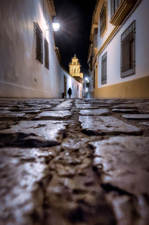 Free Explore the charming alleyways of Córdoba, Spain, at night, highlighted by historic architecture. Stock Photo