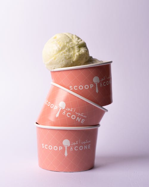 Three ice cream cones with a scoop of ice cream