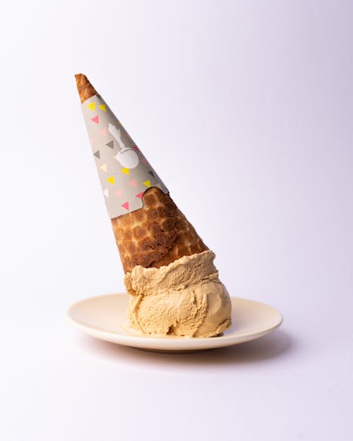 A cone with sprinkles on top of it