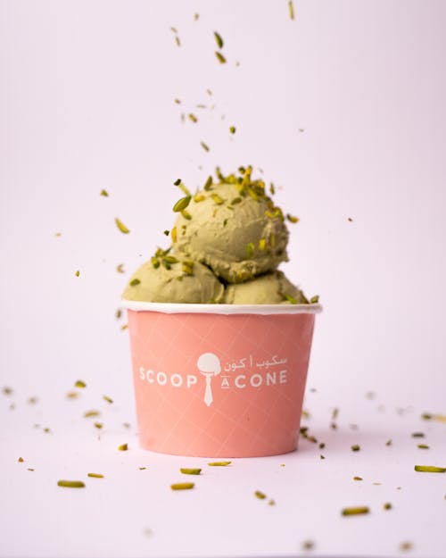A scoop of ice cream with green leaves on top